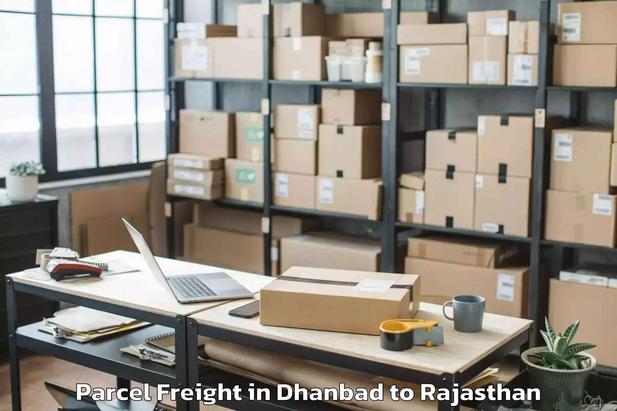 Easy Dhanbad to Baswa Parcel Freight Booking